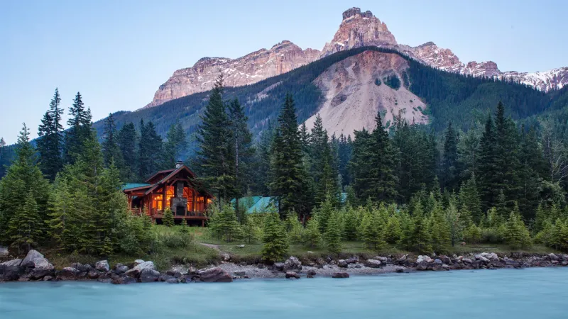 Lodge grounds with mountain backdrop