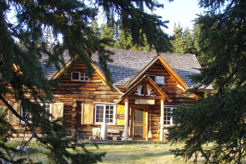 Historic log cabin exterior in summer