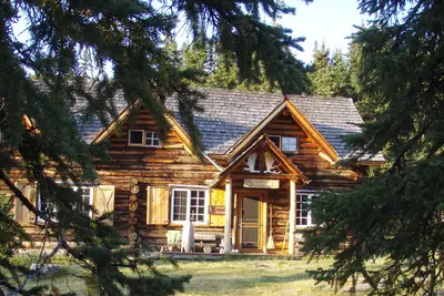 Historic log cabin exterior in summer